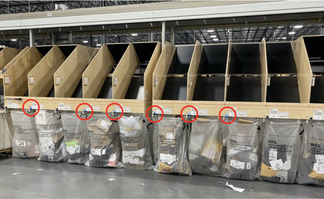 bins on sorting equipment with light circled